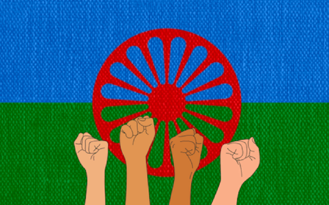 Fists risen up, Romani flag in the background