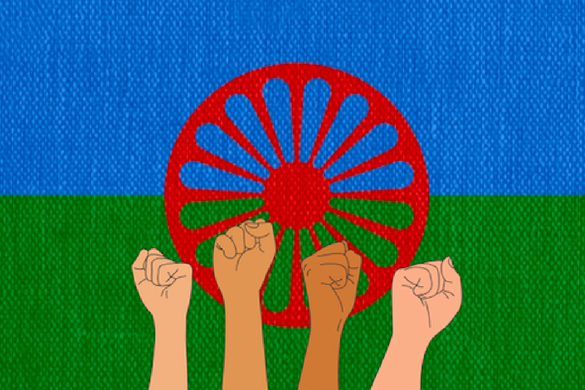 Fists risen up, Romani flag in the background